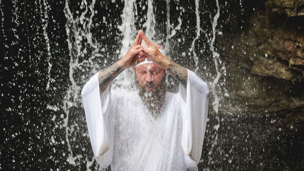 Meditation under a waterfall is among the rituals required to become a certified Yamabushi (Credit: Westend61/Getty Images)