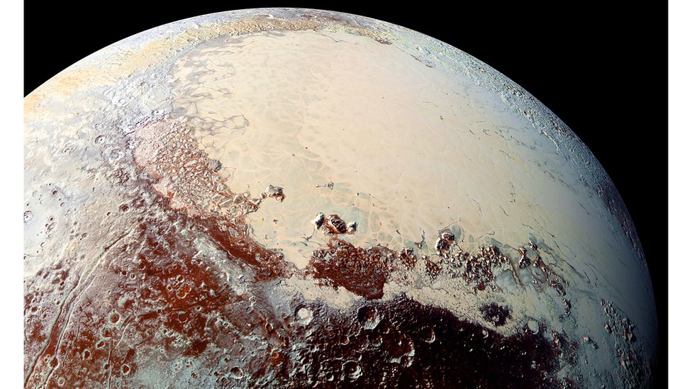 Pluto's Sputnik Planitia glacier is primarily made from nitrogen ice, and contains thousands of pits suspected to be caused by floating islands of water ice (Credit: Alamy)