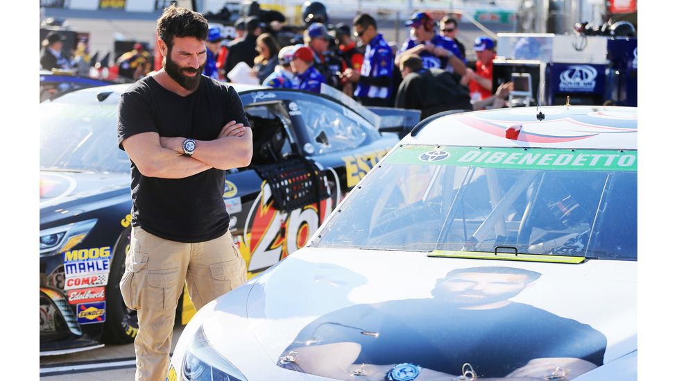 Dan Bilzerian looks at a branded racing car bearing his image in Richmond, Virginia (Credit: Daniel Shirey/Getty Images)