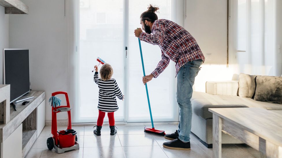 Men helping tackle hidden household labour that disproportionately falls on women could help lighten the load on mums, and create more equal households (Credit: Getty Images)