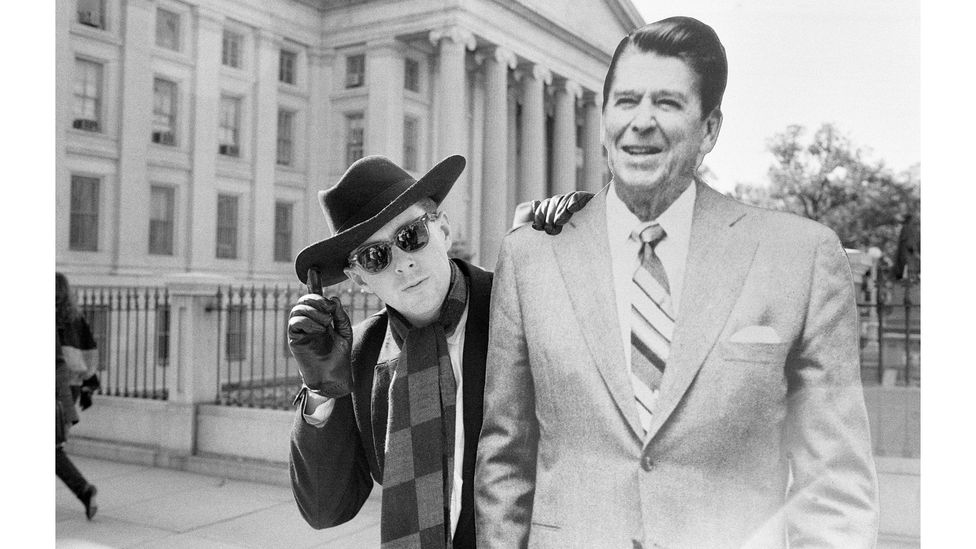 Frankie Goes to Hollywood frontman Holly Johnson posing outside the White House with a full-size cut-out of Ronald Reagan in 1984 (Credit: Mike Maloney/Mirrorpix/Getty Images)