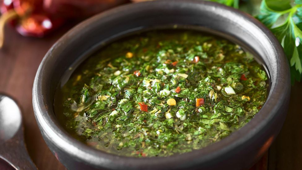 Chimichurri is a blend of finely chopped parsley, oregano, ground chilli and minced garlic mixed with vinegar and vegetable oil (Credit: Panther Media GmbH/Alamy)
