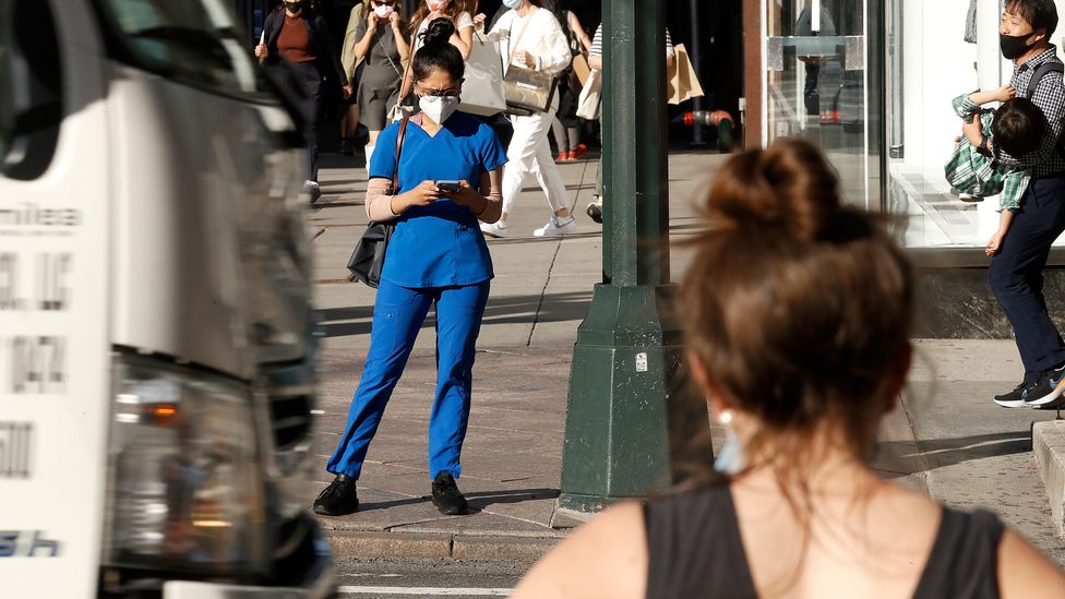 Most of us use our phones while we are doing something else, which can mean we are less alert to spot potential scams (Credit: John Lamparski/Getty Images) Most of us use our phones while we are doing something else, which can mean we are less alert to spot potential scams (Credit: John Lamparski/Getty Images)