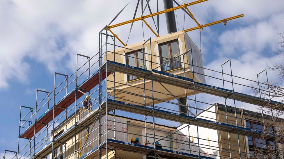 Modular construction, as well as using greener materials, is helping to reduce the emissions of construction beyond its machinery (Credit: Getty Images)