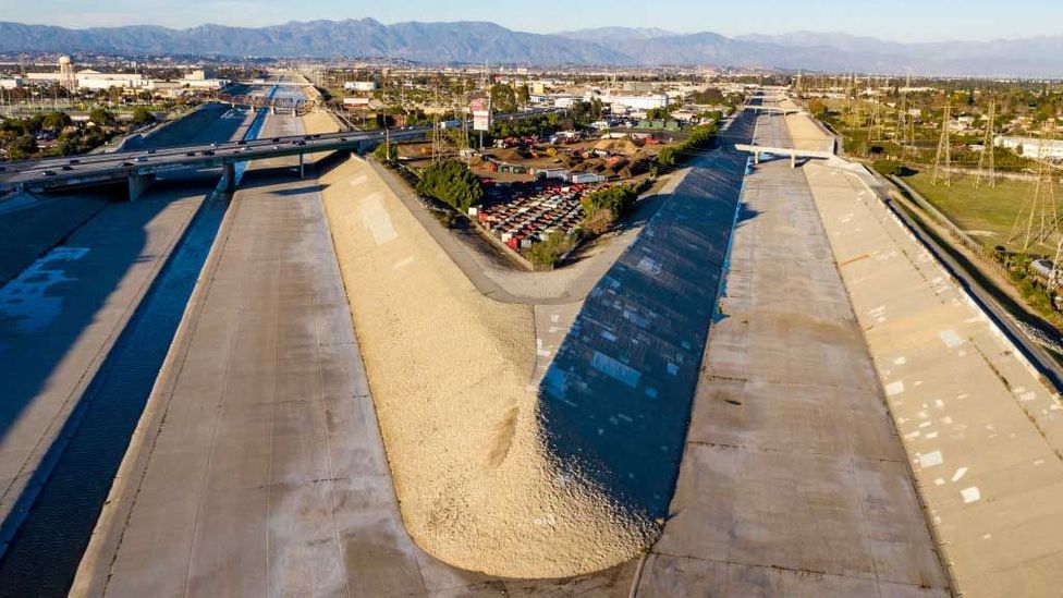 The Los Angeles River was once free-flowing, but after flooding in the early 20th Century, it was encased in a more controllable channel (Credit: Brian van der Brug/Getty Images)