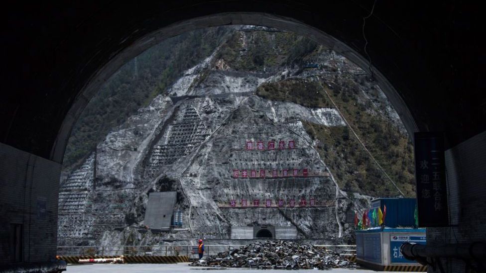 Nature, subsumed: towering walls of concrete entomb forests on mountainsides in south-west China, to build a major dam (Credit: Johannes Eisele/Getty Images)