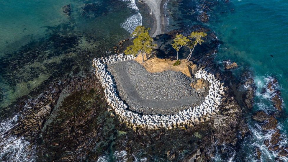 Concrete "tetrapods" protect a tidal island from the ocean in Kesennuma, Japan (Credit: Carl Court/Getty Images)