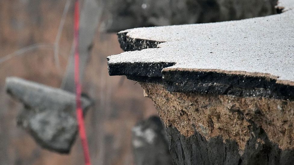 It may be strong, but all things erode eventually. Chunks of concrete and asphalt hang over a cliff in Pacifica, California after a storm (Credit: Josh Edelson/Getty Images)