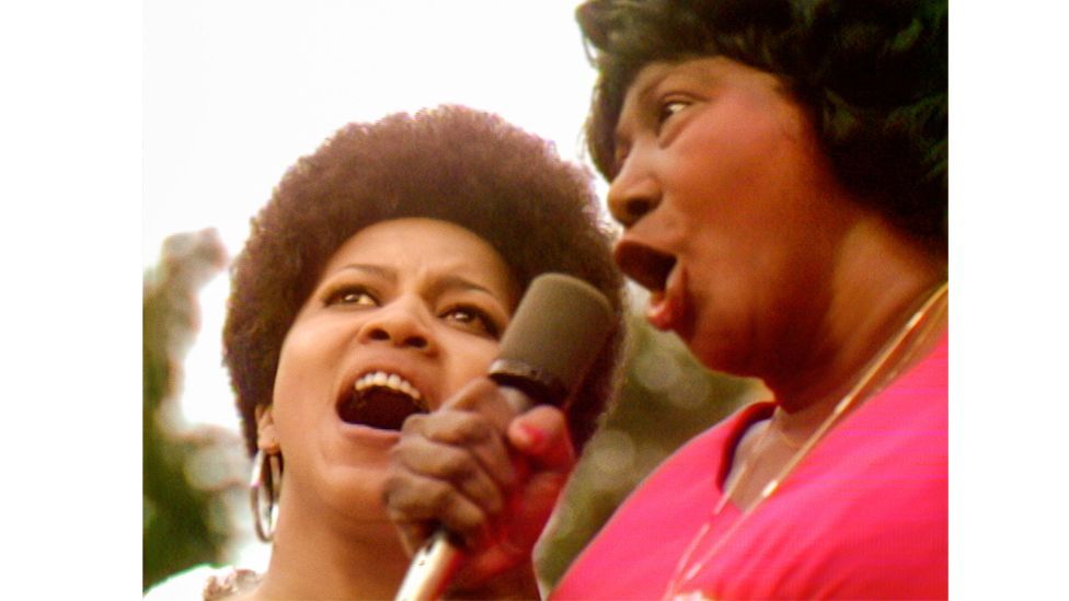 Mahalia Jackson and Mavis Staples sing gospel together at the 1969 concert (Credit: Courtesy of Searchlight Pictures)