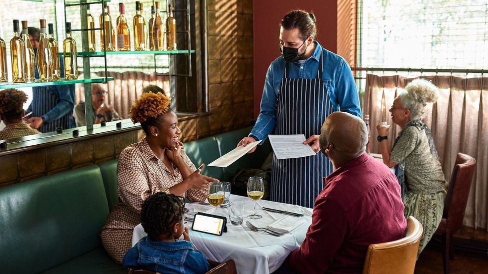 Experts saying doing activities like dining indoors can take a while for people to get used to doing again (Credit: Getty)