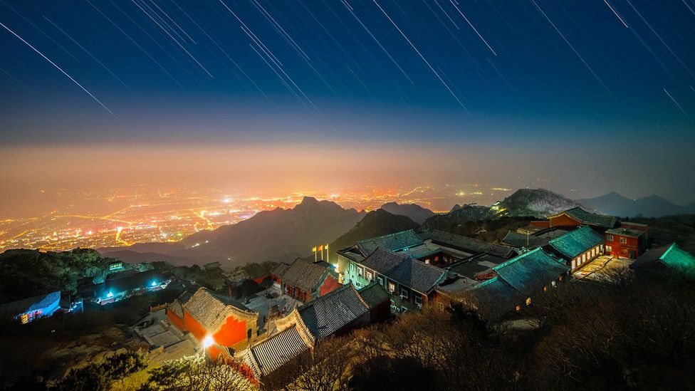The glow given off by large towns and cities at night can often be seen for many miles around (Credit: Dneutral Han/Getty Images) The glow given off by large towns and cities at night can often be seen for many miles around (Credit: Dneutral Han/Getty Images)