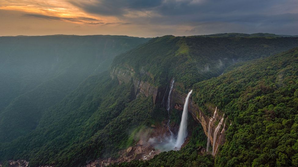 View of Nokhalikai waterfall and surrounding green hills in Sohra, India