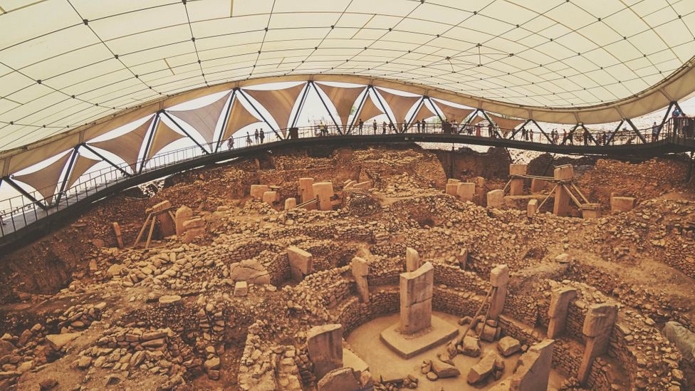 Central monumental buildings of Göbekli Tepe under swooping fabric-and-steel shelter