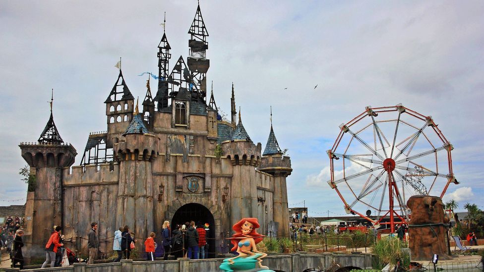 Artist Banksy opened a temporary bemusement park parody called Dismaland in the UK seaside town Weston-super-Mare (Credit: Alamy)