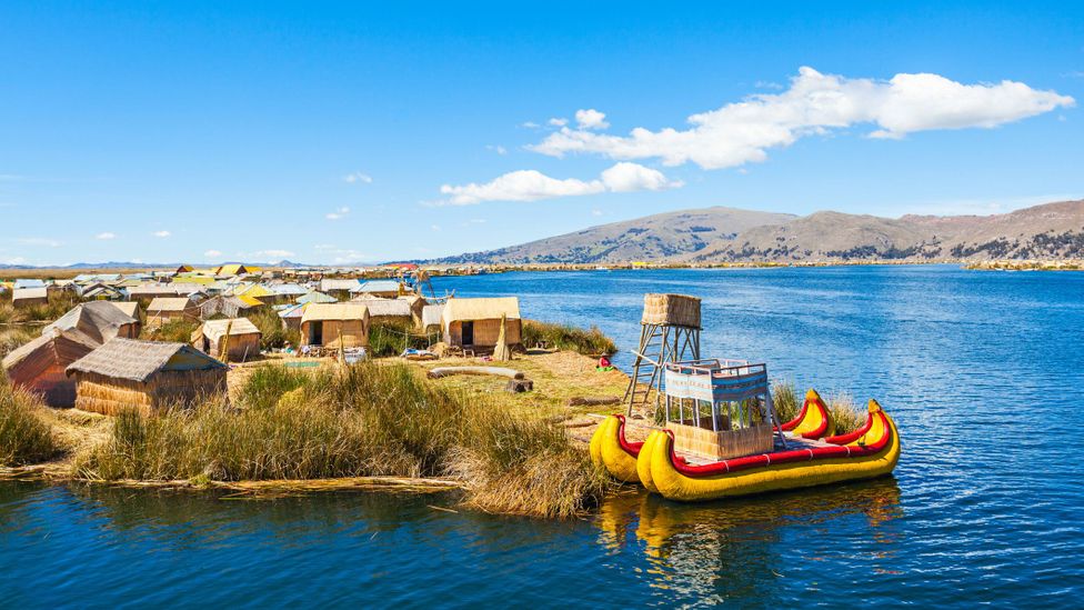 Lake titicaca on the border of bolivia and peru is home to the cultivated reed islands of the uru people (credit: saiko3p/getty images)