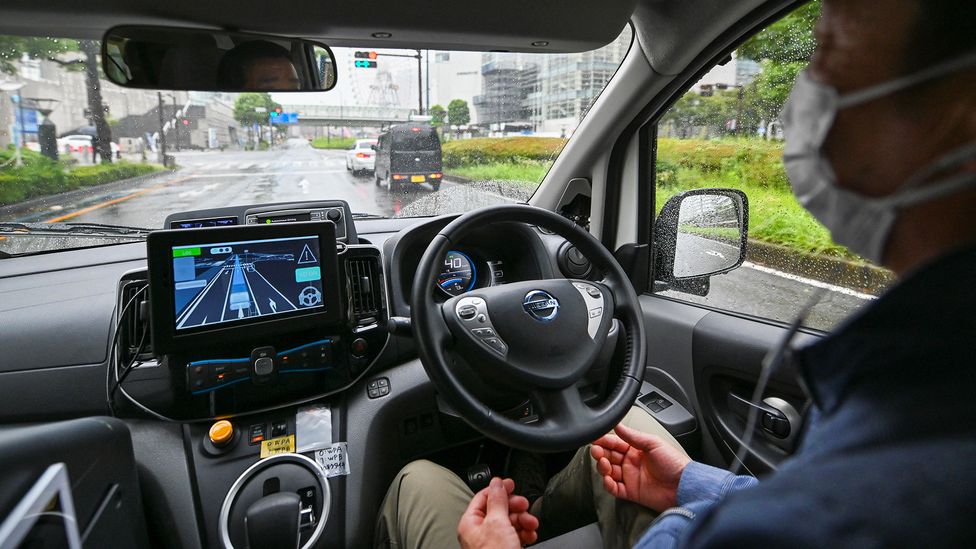 If we are to adopt self-driving vehicles it will require people to trust the technology entirely – will that be a good thing? (Credit: Kazuhiro Nogi/AFP/Getty Images)