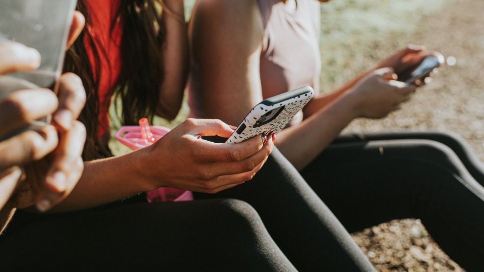 Women looking at their smartphones