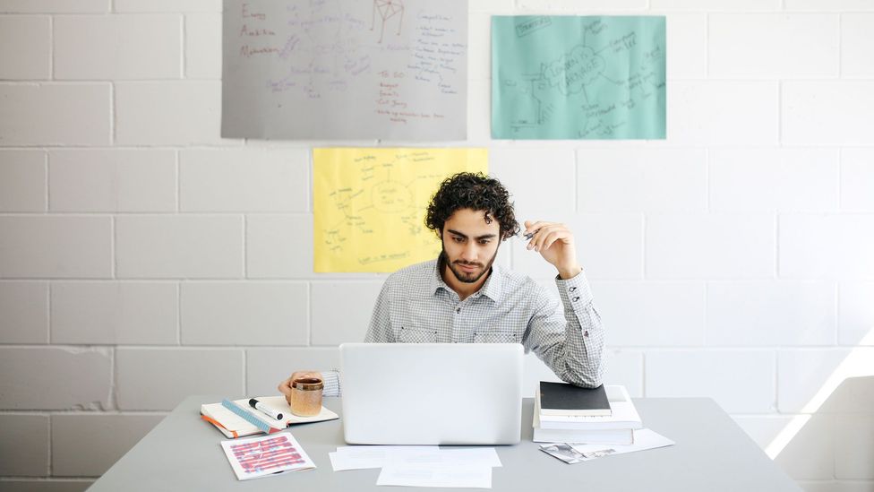 Many US workers are worried about seeming uncommitted or like a 'slacker' if they aren't at their desks (Credit: Getty Images) Many US workers are worried about seeming uncommitted or like a 'slacker' if they aren't at their desks (Credit: Getty Images)