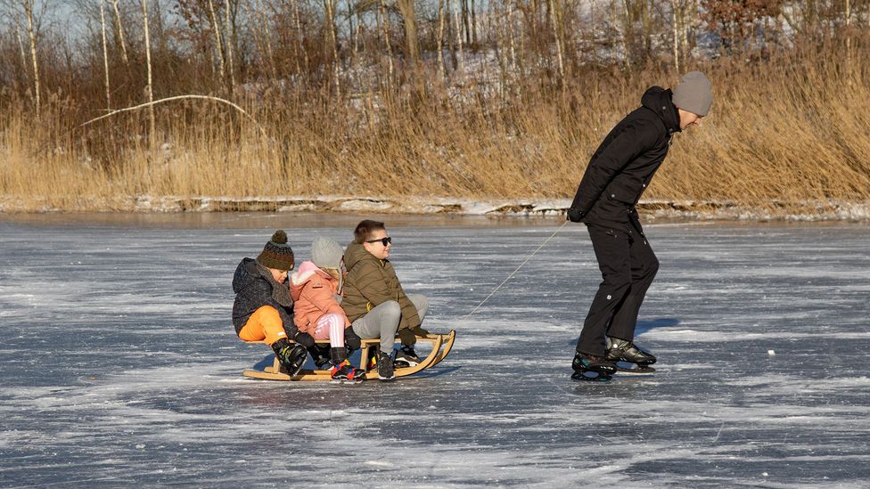 Skating on frozen ponds and rivers in the Netherlands used to be common in winter, but it rarely gets cold enough in recent decades (Credit: Nicolas Economou/Getty Images)