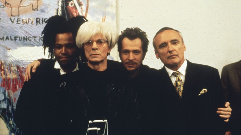 In the biopic Basquiat (1996), Bowie plays the role of Andy Warhol with a wry playfulness (Credit: BFI)