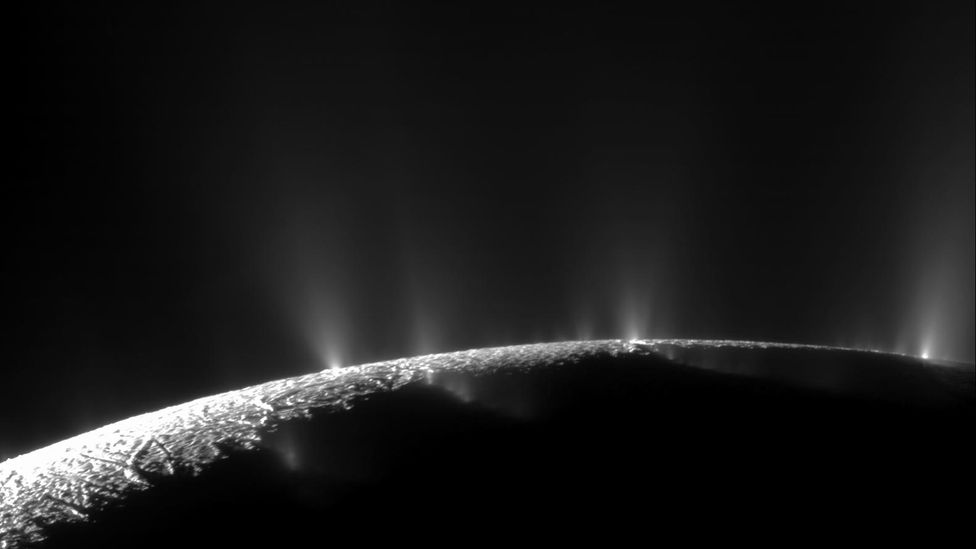 Plumes of water vapour burst from the icy surface of Saturn's sixth largest moon Enceladus – signs of the liquid ocean lurk below (Credit: Nasa/JPL/Space Science Institute)
