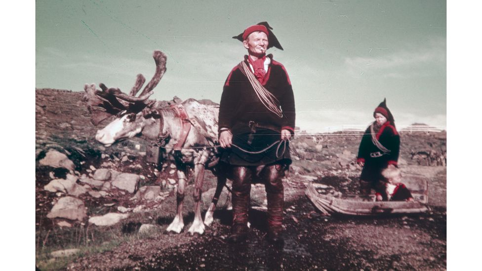 In the past, Sámi children and their families roamed widely with their reindeer, as in this scene from the 1940s (Credit: Finnish Heritage Agency)