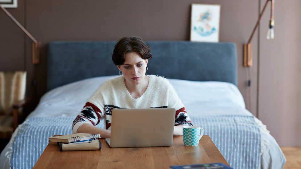 Woman looking at her laptop