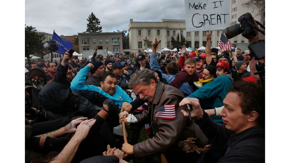 A fight at a pro-President Donald Trump rally and march at the Martin Luther King Jr Civic Center park, 4 March, 2017 in Berkeley, California (Credit: Leah Millis)