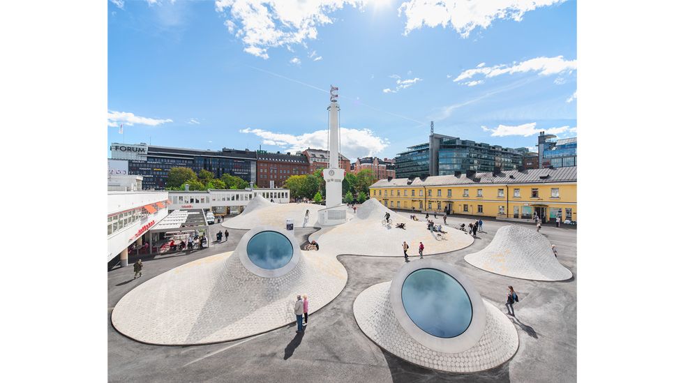 The undulating domes of new art museum Amos Rex, Helsinki, act as a play area where visitors of all ages can climb and slide (Credit: Mika Huisman/ Amos Rex)