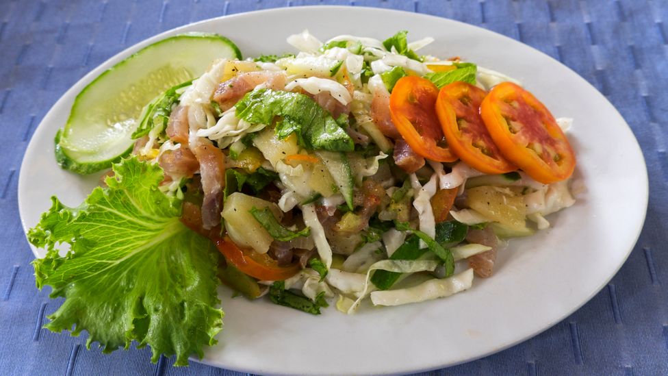 Traditional dishes, like smoked fish salad, are becoming increasingly hard to find in Seychelles (Credit: Anders Blomqvist/Getty Images)
