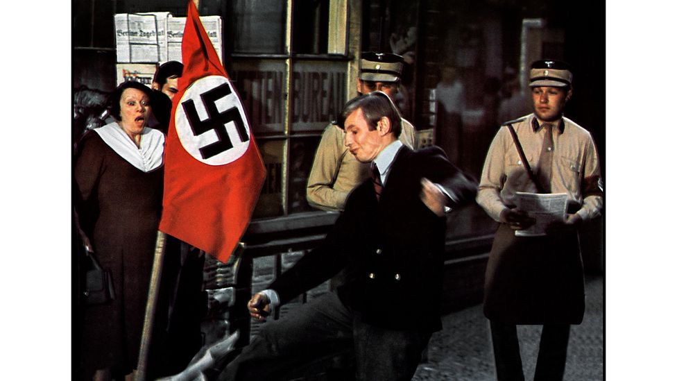 Nazism is the creeping beast in Cabaret – by the film's end, the Kit Kat Club has become the toy of fascists (Credit: Alamy)