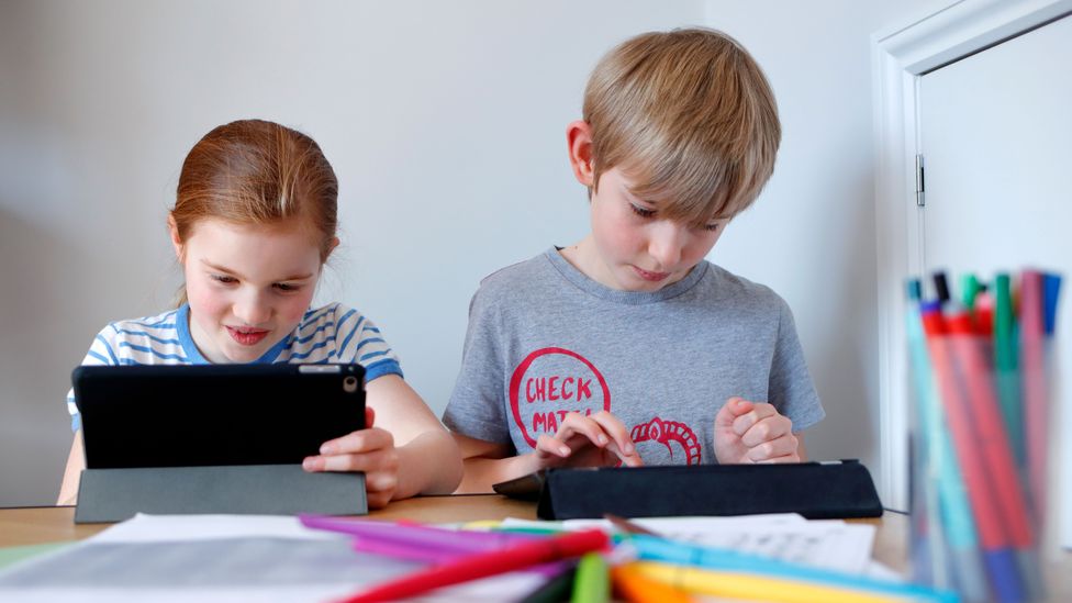 Kids may seem lost in their screens, but often they are socialising (Credit: Max Mumby/Getty Images)
