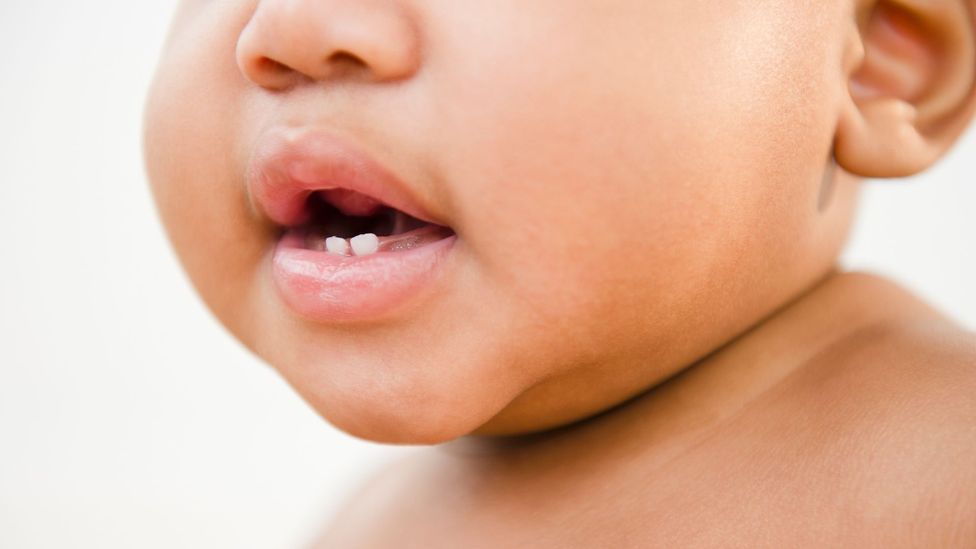 A close-up of a baby's half-open mouth (Credit: Getty Images)