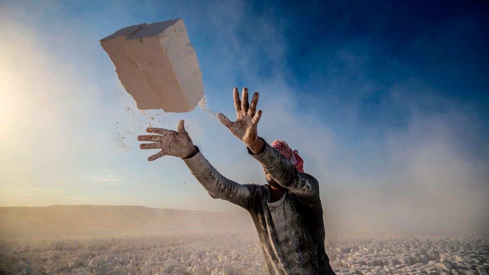 A labourer works at the "White Mountain" limestone extraction quarry site near Egypt's southern city of Minya (Credit: Khaled Desouki/Getty Images)