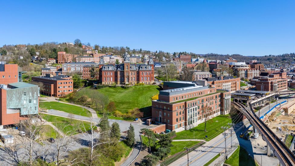 Areas home to large educational institutions, like West Virginia University in Morgantown, tend to have smaller pay gaps for young women (Credit: Getty Images)