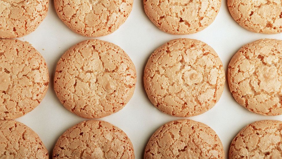 Macarons des Sœurs are a uniform pale brown and are finely cracked on top (Credit: Maurice Rougemont/Getty Images)