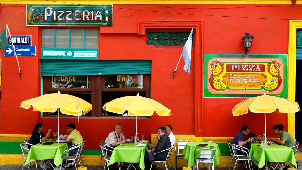 Pizza topped with fainá likely developed in working-class Italian migrant barrios such as La Boca (Credit: Hemis/Alamy)