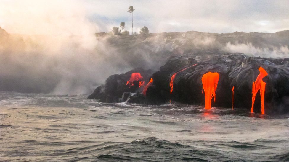 Hawaii's volcanoes are unusual, because they're in the middle of a tectonic plate (Credit: Alamy)