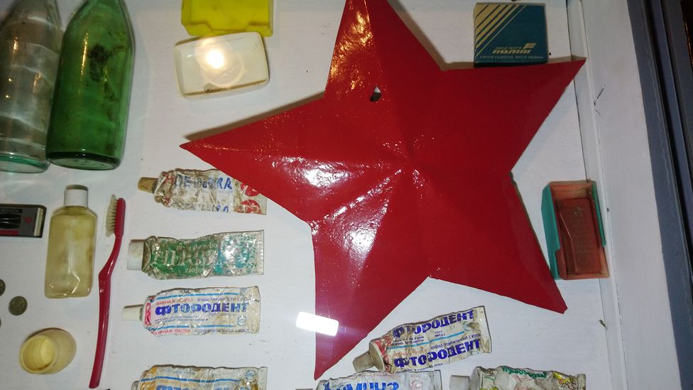 A red toothbrush to match the star? Some of the used tubes of toothpaste carry the brand name "Fluorodent" in Cyrillic (Credit: Mieczyslaw Zuk)