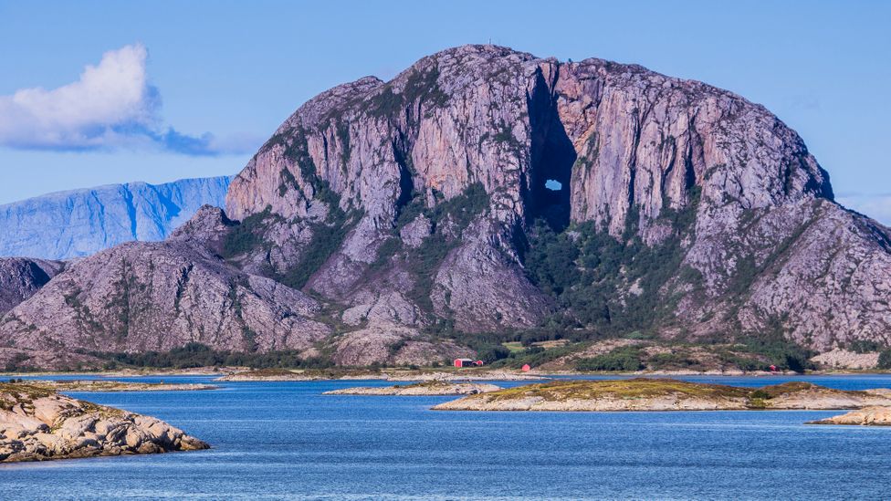 Torghatten looms over the route, easily recognised due to its distinctive hole (Credit: Dag Sundberg/Getty Images)