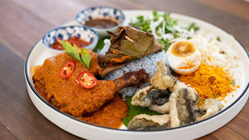 Nasi kerabu (a type of nasi ulam with blue rice) is an aromatic Peranakan dish (Credit: simon2579/Getty Images)