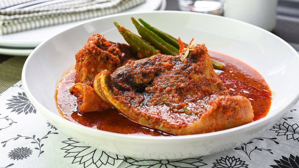Peranakan dishes like ikan asam pedas (spicy tamarind fish) can be sour, spicy and bursting with umami (Credit: i'am/Getty Images)