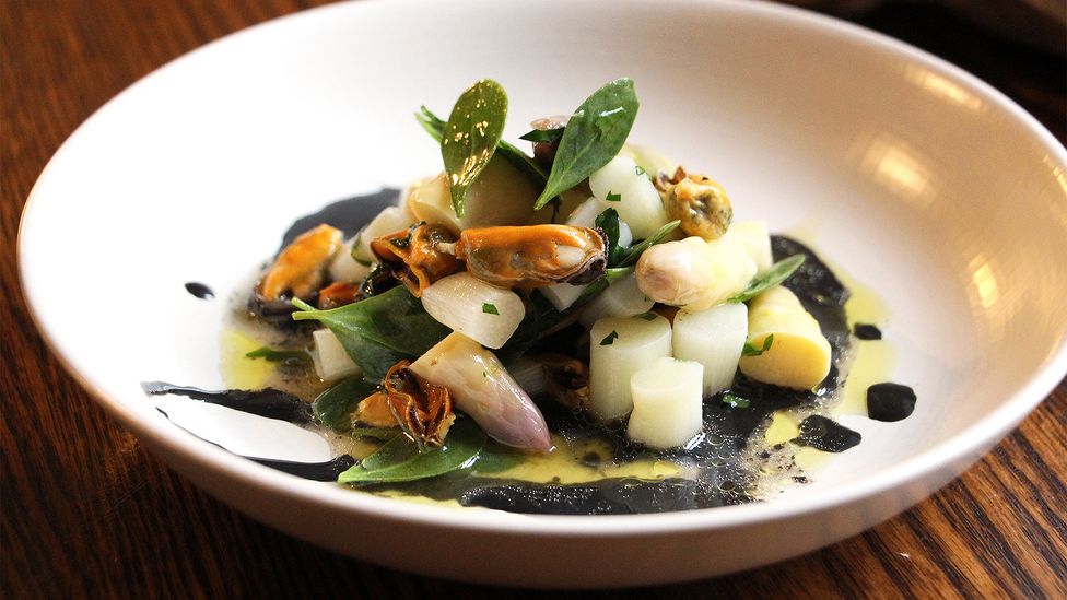 Mussels with white asparagus and squid ink sauce at Le Presbytere (Credit: Emily Monaco)