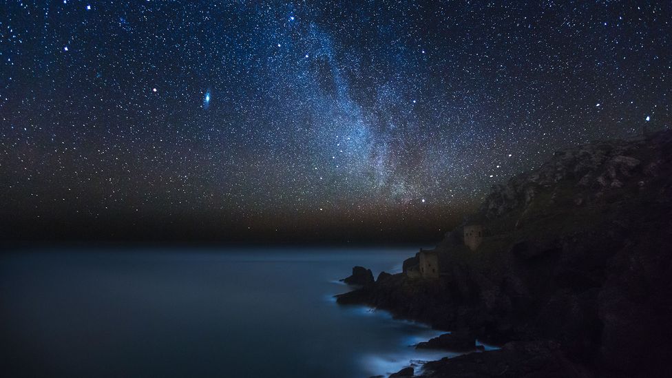 An image of Botallack Mine in Cornwall at night shows hundreds of stars in the sky (Credit: Matt Stansfield/Getty)