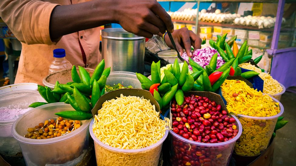 The jhal-muri wallah is often as much of a draw as the snack, with some vendors commanding cult followings (Credit: Arindam Ghosh/Getty Images)