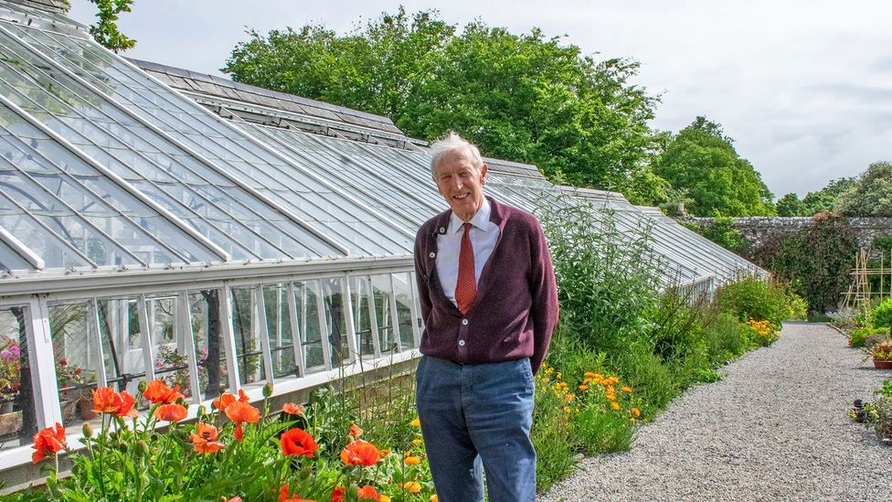 The Hon. John Rous, shown here in Clovelly Court Gardens, has owned Clovelly since 1983 (Credit: Amanda Ruggeri/BBC)
