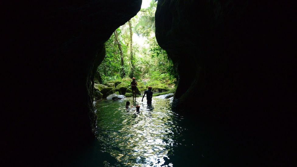 The only way into the ATM Cave is to swim (Credit: Belize Tourism Board)