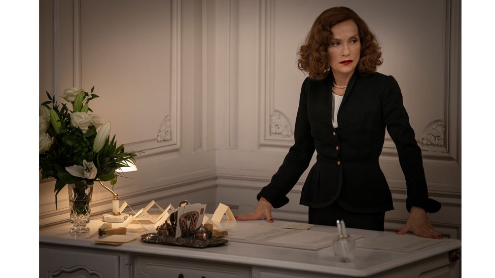 Isabelle Huppert features in the film as Claudine Colbert, the formidable director at the house of Dior (Credit: Dávid Lukács / 2021 Ada Films Ltd)