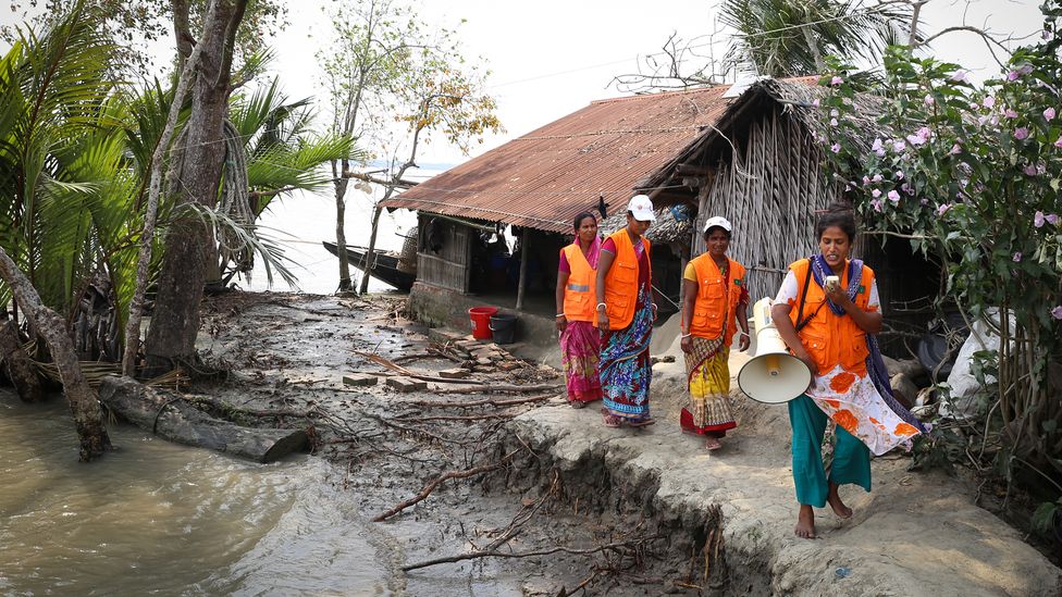 Volunteers in Bangladesh's Cyclone Preparedness Programme (CPP) take part in an early warning drill in Chila village, April 2022 (Credit: Catherine Davison)