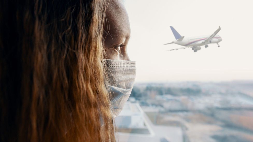 Worried woman watching a plane taking off
